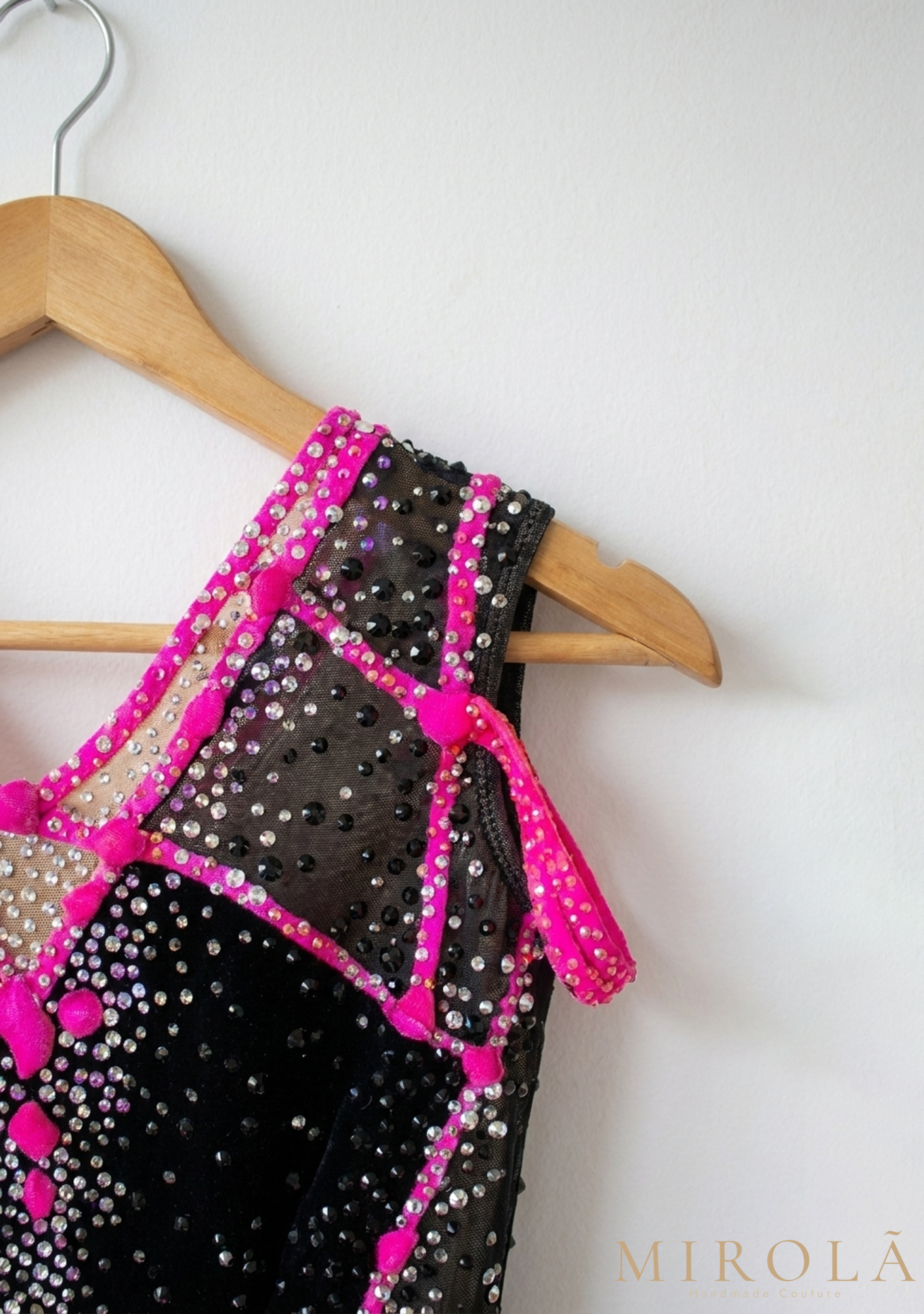 Fuchsia rhythmic gymnastics competition leotard — hip and strap detail